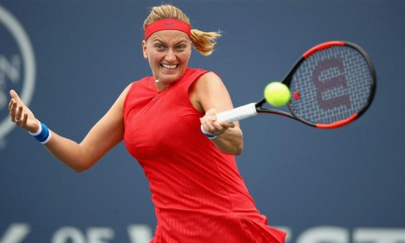 Petra Kvitova of the Czech Republic returns a shot to Kateryna Bondarenko of the Ukraine at Stanford University in California
