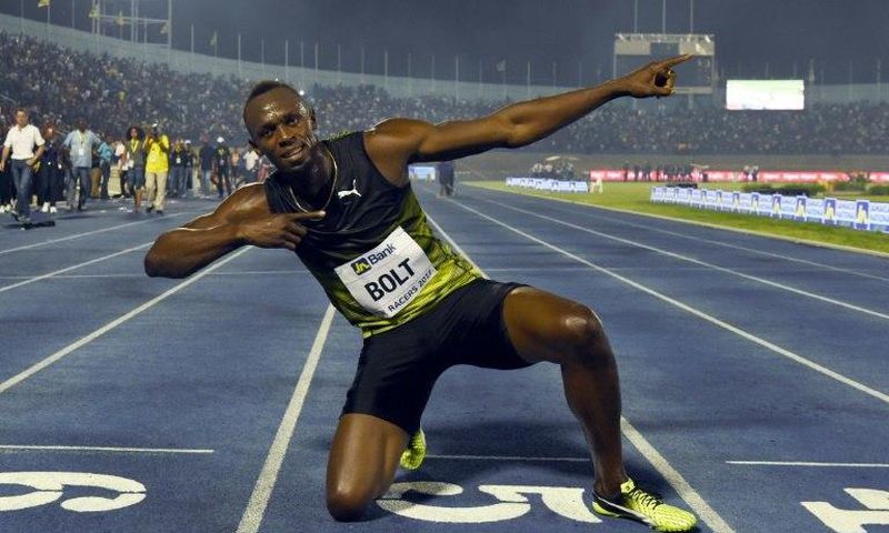 Usain Bolt (C) of Jamaica reacts after winning his final race in home country during the Racers Grand Prix at the national stadium in Kingston, Jamaica, on June 10, 2017