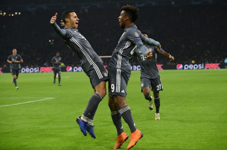Bayern Munich's Kingsley Coman (R) celebrates with Thiago Alcantara (L) after the former scored against Ajax in the Champions League on Wednesday.