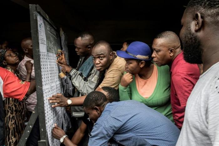 Queues built up at many polling stations as voters searched for their name on the electoral roll