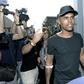 Brazilian football player Douglas Costa (C) is surrounded by supporters and photographers upon his arrival at the Juventus' Medical Center in Turin on July 12, 2017