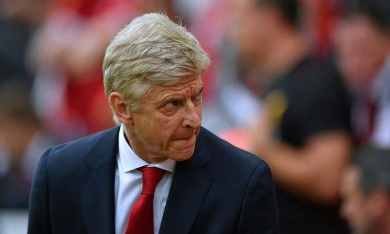 Arsenal's manager Arsene Wenger takes his seat for the English Premier League football match against Liverpool August 27, 2017