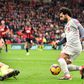 Liverpool's Egyptian midfielder Mohamed Salah (R) takes the ball around Bournemouth's Bosnian-Herzegovinian goalkeeper Asmir Begovic (L0 in the build-up to scoring his third goal, Liverpool's fourth during the English Premier League football match betw...