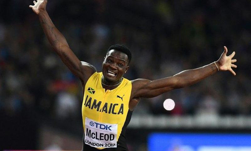 Jamaica's Omar Mcleod celebrates his victory in the final of the men's 110m hurdles at the 2017 IAAF World Championships in London on August 7, 2017