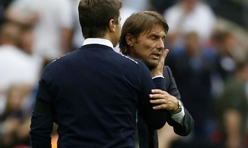 Tottenham Hotspur's head coach Mauricio Pochettino (L) and Chelsea's head coach Antonio Conte interact during an English Premier League football match in London, on August 20, 2017
