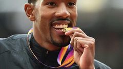 Gold medallist US athlete Christian Taylor poses on the podium during the victory ceremony for the men's triple jump athletics event at the 2017 IAAF World Championships at the London Stadium in London August 11, 2017