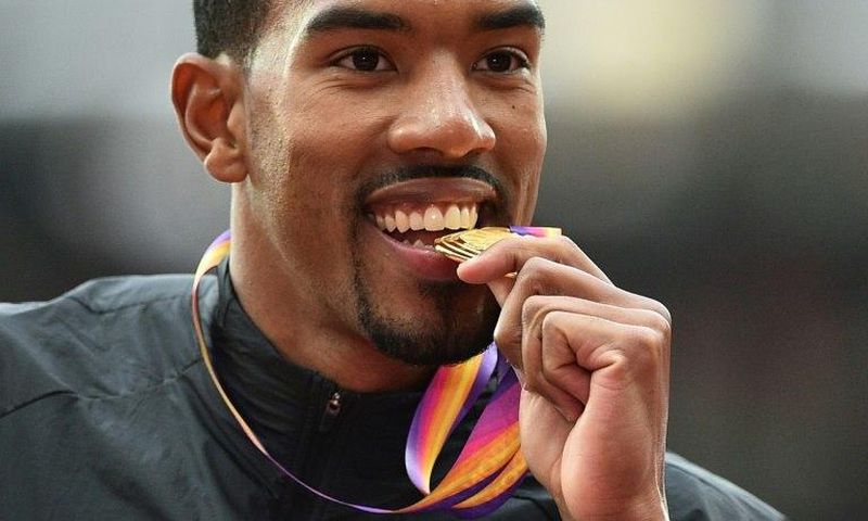 Gold medallist US athlete Christian Taylor poses on the podium during the victory ceremony for the men's triple jump athletics event at the 2017 IAAF World Championships at the London Stadium in London August 11, 2017