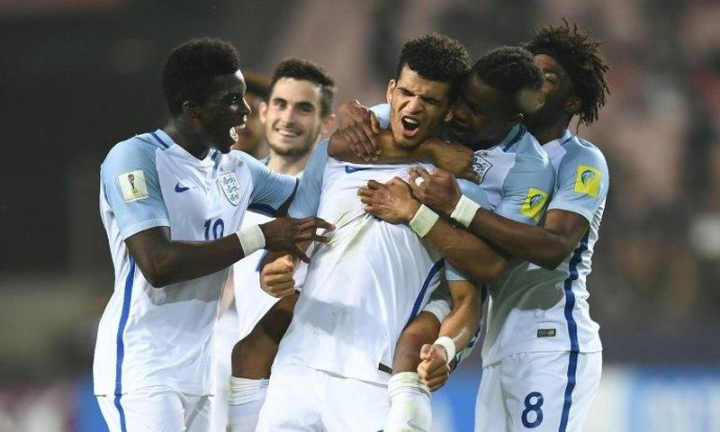 England forward Dominic Solanke celebrates a goal with teammates in the U-20 World Cup semi-final against Italy in Jeonju, South Korea, on June 8, 2017