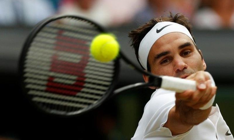 Switzerland's Roger Federer returns against Croatia's Marin Cilic during their men's singles final match on the last day of the 2017 Wimbledon Championships July 16, 2017