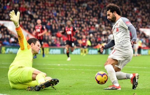 Liverpool's Mohamed Salah completes his hat-trick in a 4-0 win at Bournemouth on Saturday