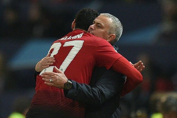 Marouane Fellaini celebrates scoring the winning goal for Manchester United against Young Boys with manager Jose Mourinho
