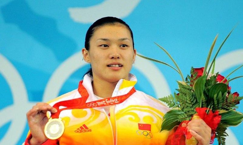 Gold medalist Cao Lei of China poses during the medal ceremony for the women's 75 kg weightlifting event during the 2008 Beijing Olympic Games on August 15, 2008