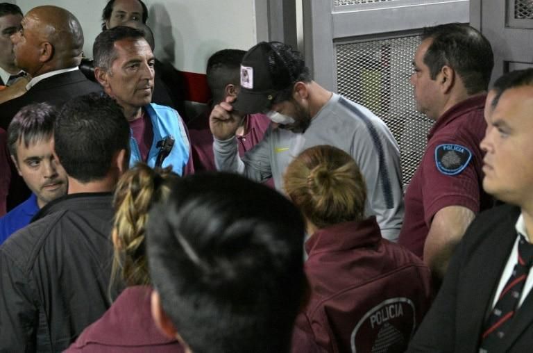 Boca Juniors' captain Pablo Perez (with cap) returns from hospital to the Monumental stadium in Buenos Aires ahead of the Copa Libertadores final