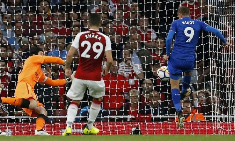 Leicester City's English striker Jamie Vardy (R) scores his side's second goal past Arsenal's Czech goalkeeper Petr Cech during the English Premier League match at the Emirates Stadium in London on August 11, 2017