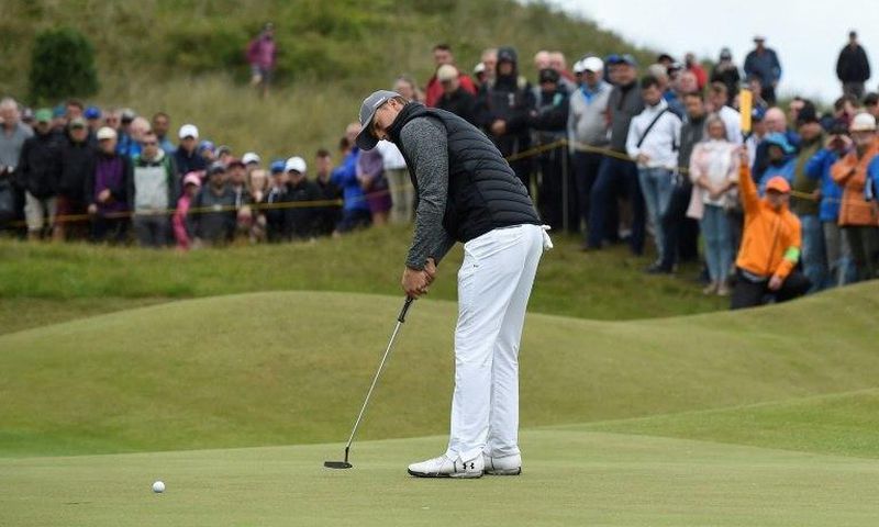 US golfer Jordan Spieth putts on the 3rd green during his opening round 65 on the first day of the Open Golf Championship at Royal Birkdale, on July 20, 2017