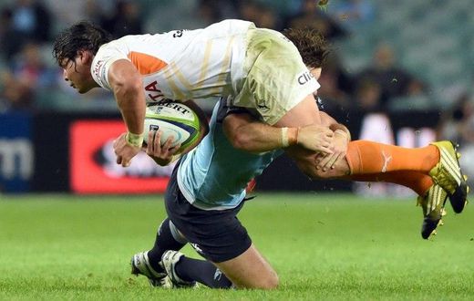Central Cheetahs player Francois Venter is tackled during a Super Rugby match against the NSW Waratahs in Sydney in May 2016