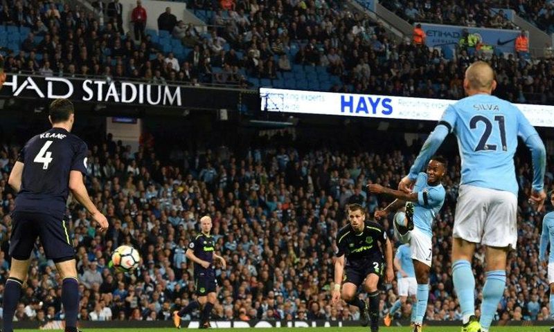 Manchester City's midfielder Raheem Sterling (2ndR) scores against Everton at the Etihad Stadium in Manchester, north west England, on August 21, 2017