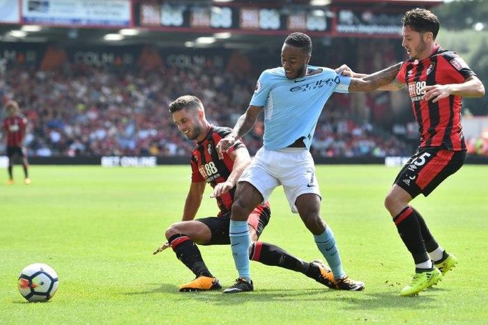 Manchester City midfielder Raheem Sterling (centre) vies with Bournemouth players during their English Premier League match at the Vitality Stadium in Bournemouth on August 26, 2017