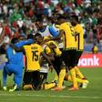 Jamaica's players celebrate after defeating Mexico 1-0 in their semi-final game during the 2017 CONCACAF Gold Cup on July 23, 2017