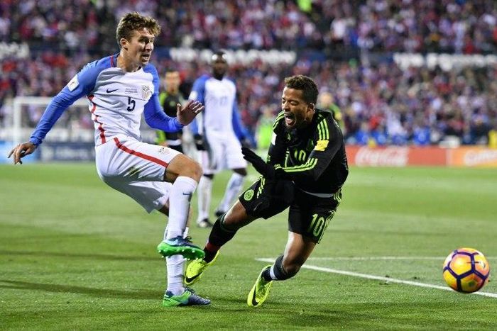 Matt Besler of the United States kicks the ball against Giovani Dos Santos of Mexico in the second half during the FIFA 2018 World Cup Qualifier November 11, 2016 in Columbus, Ohio