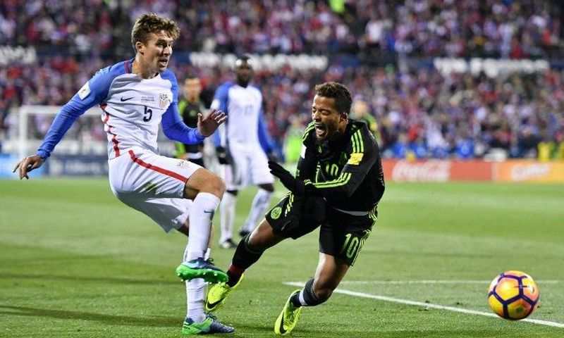 Matt Besler of the United States kicks the ball against Giovani Dos Santos of Mexico in the second half during the FIFA 2018 World Cup Qualifier November 11, 2016 in Columbus, Ohio