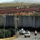 UN peacekeepers patrol the border wall separating Lebanon from Israel on December 9, 2018, after the Israeli army said it had uncovered Hezbollah infiltration tunnels underneath