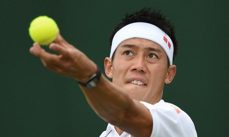 Japan's Kei Nishikori serves against Italy's Marco Cecchinato during their men's singles first round match on the first day of the 2017 Wimbledon Championships at The All England Lawn Tennis Club in Wimbledon, southwest London, on July 3, 2017
