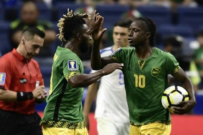 Darren Mattocks (R) of Jamaica celebrates with teammate Owayne Gordon after scoring a goal against El Salvador during their CONCACAF Gold Cup Group C match, at the Alamodome in San Antonio, Texas, on July 16, 2017