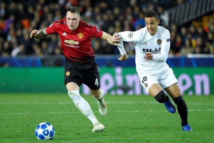 Phil Jones scored an embarassing own goal but Manchester United qualify for Champions League last 16