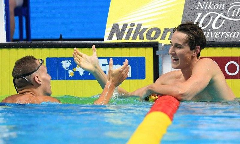Australia's Cameron McEvoy (R) talks to USA's Caeleb Dressel after competing in a 100m freestyle semi-final during the 2017 FINA World Championships in Budapest, on July 26