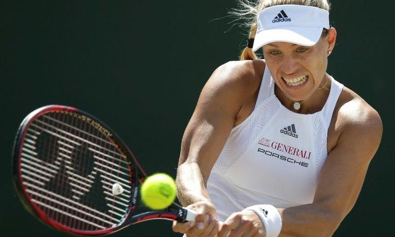 Germany's Angelique Kerber returns against Spain's Garbine Muguruza during their women's singles match during the 2017 Wimbledon Championships in Wimbledon, southwest London, on July 10, 2017