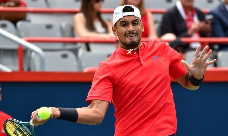 Nick Kyrgios hits a return against Viktor Troicki on August 7, 2017 in Montreal, Quebec, Canada