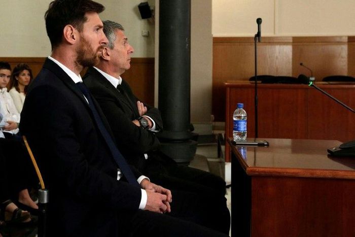 Barcelona's football star Lionel Messi (L) and his father Jorge Horacio Messi face judges in a tax fraud case in court in Barcelona in June 2016