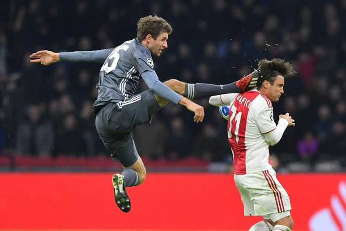 Bayern Munich's German forward Thomas Mueller (L) was shown a straight red for this kick on Ajax's Aregntine defender Nicolas Tagliafico during the 3-3 draw in Amsterdam on Wednesday in the Champions League.