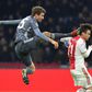 Bayern Munich's German forward Thomas Mueller (L) was shown a straight red for this kick on Ajax's Aregntine defender Nicolas Tagliafico during the 3-3 draw in Amsterdam on Wednesday in the Champions League.