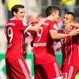 Munich's forward Robert Lewandowski (C) celebrates after scoring the first goal with midfielder Sebastian Rudy (L) and defender Rafinha during the German football Cup DFB Pokal first round match against Chemnitzer FC August 12, 2017