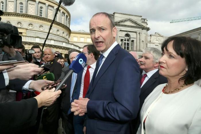 Fianna Fail leader Micheal Martin (C, pictured March 2016) said that his party is "determined that the political chaos we see in London will not be allowed to spread to Ireland"
