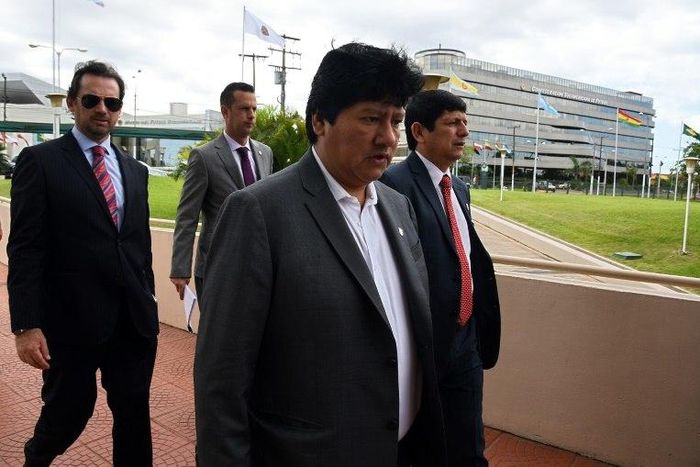 Peru's Football Federation chief Edwin Oviedo (C), pictured in 2015, was detained in an early morning raid on his home in Lima