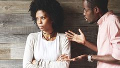 Man angrily speaking with woman [Credit: Getty]