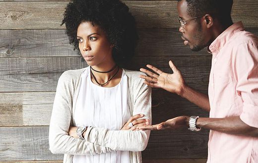 Man angrily speaking with woman [Credit: Getty]