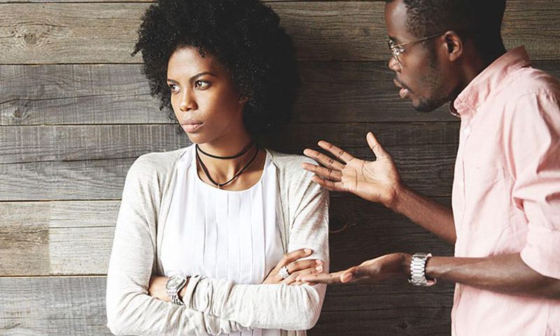 Man angrily speaking with woman [Credit: Getty]