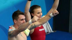 France's Laura Marino and France's Matthieu Rosset react after winning the 3m/10m team event during the diving competition at the 2017 FINA World Championships in Budapest, on July 18, 2017