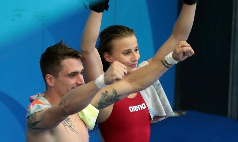 France's Laura Marino and France's Matthieu Rosset react after winning the 3m/10m team event during the diving competition at the 2017 FINA World Championships in Budapest, on July 18, 2017