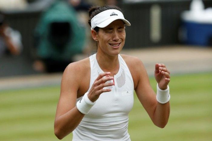 Spain's Garbine Muguruza shows her emotions after defeating Venus Williams during their women's singles final at the 2017 Wimbledon Championships in Wimbledon, southwest London, on July 15, 2017