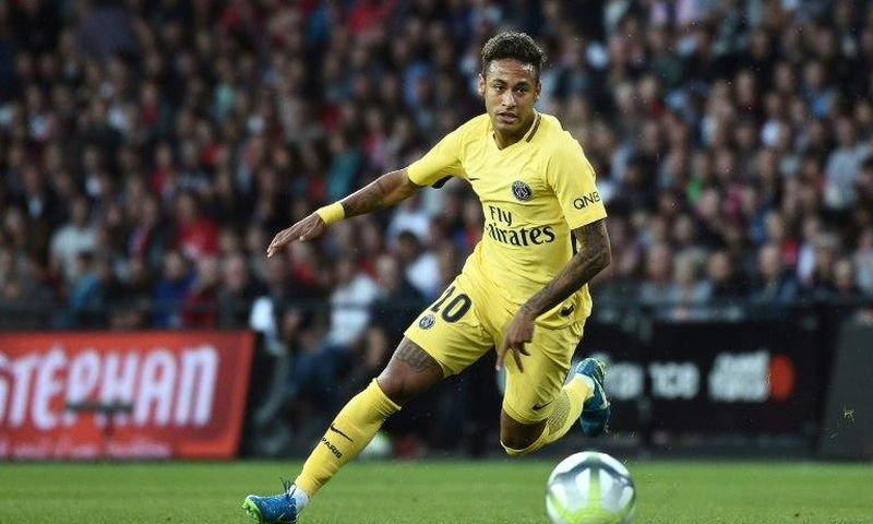 Paris Saint-Germain's Neymar drives the ball during their French Ligue 1 match against En Avant Guingamp (EAG), at the Roudourou stadium in Guingamp, on August 13, 2017