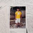 Timothy, then a seven-year-old Filipino boy, is shown in a photograph with a letter he sent to his pen pal, former US President George H.W. Bush, who sponsored him for 10 years using a pseudonym