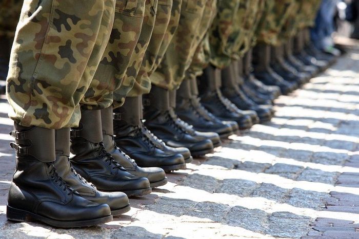 Nigerian Army putting on the Nigerian made boot