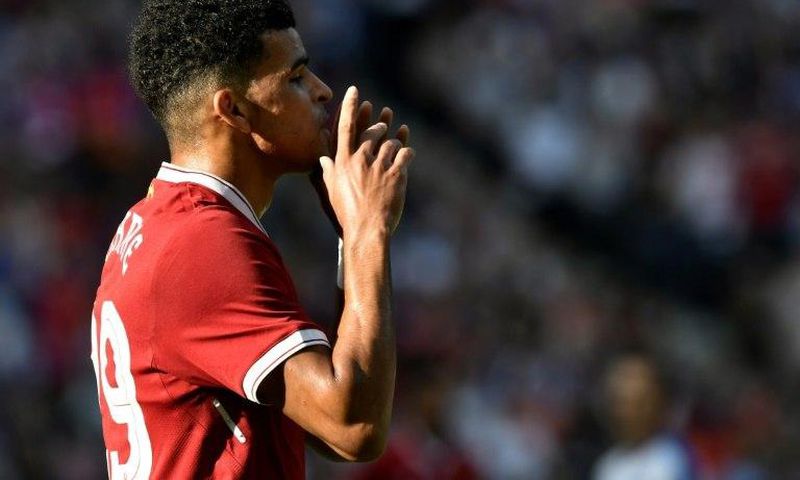 Liverpool's striker Dominic Solanke celebrates scoring during a friendly football match against Hertha Berlin on July 29, 2017