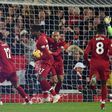 Liverpool players celebrate Divock Origi's late winning goal against Everton after a Jordan Pickford error