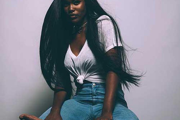 Black woman with a long hair.